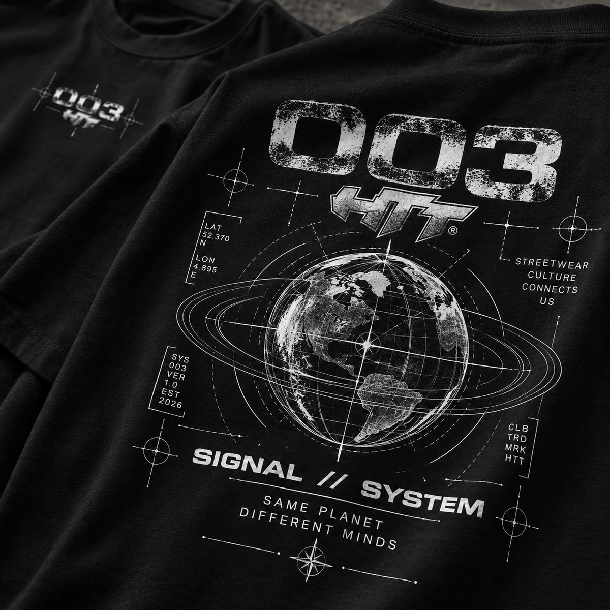 Close-up detail of HTT 003 Signal System back print with globe graphic on black T-shirt