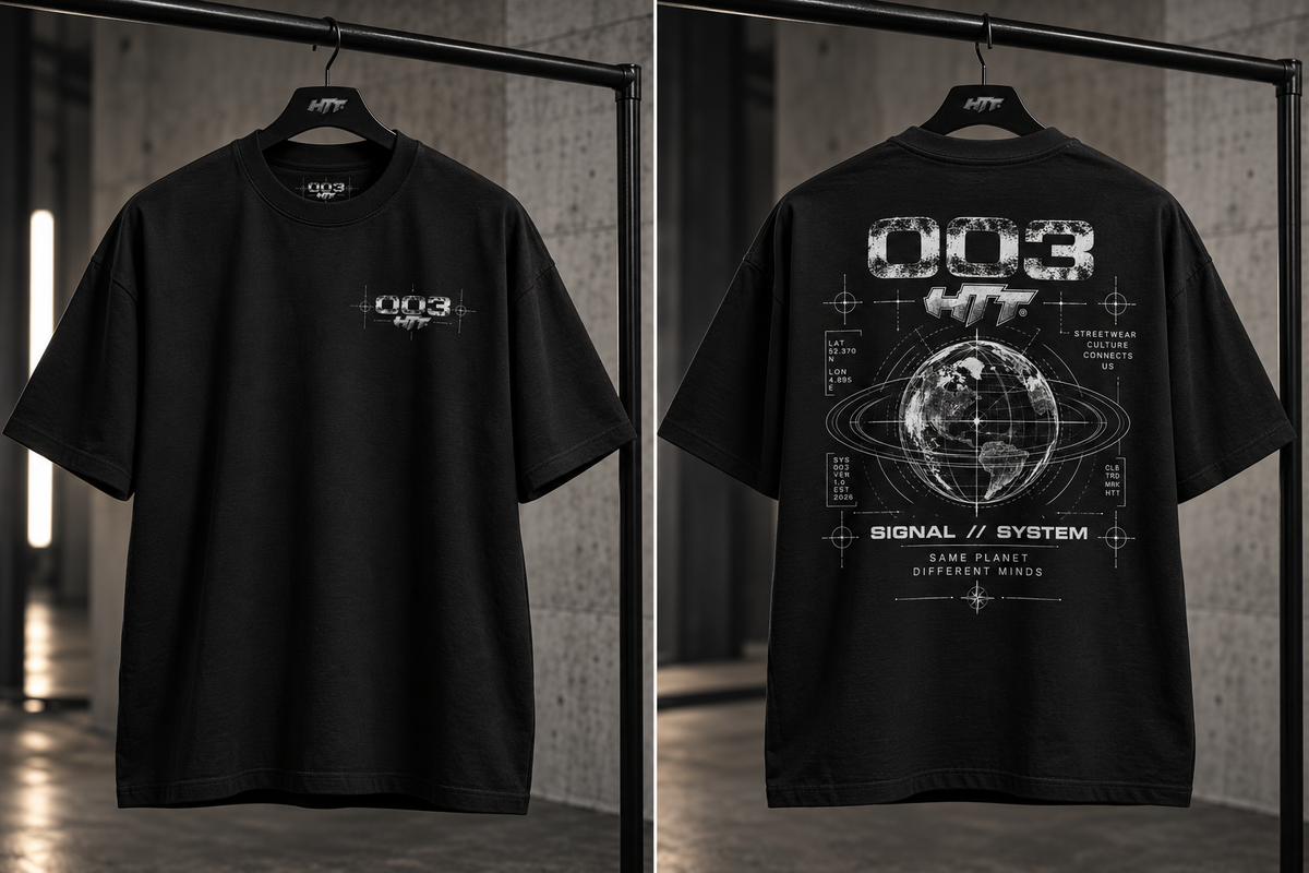 HTT 003 Signal System black oversized T-shirt on hanger showing front and back design