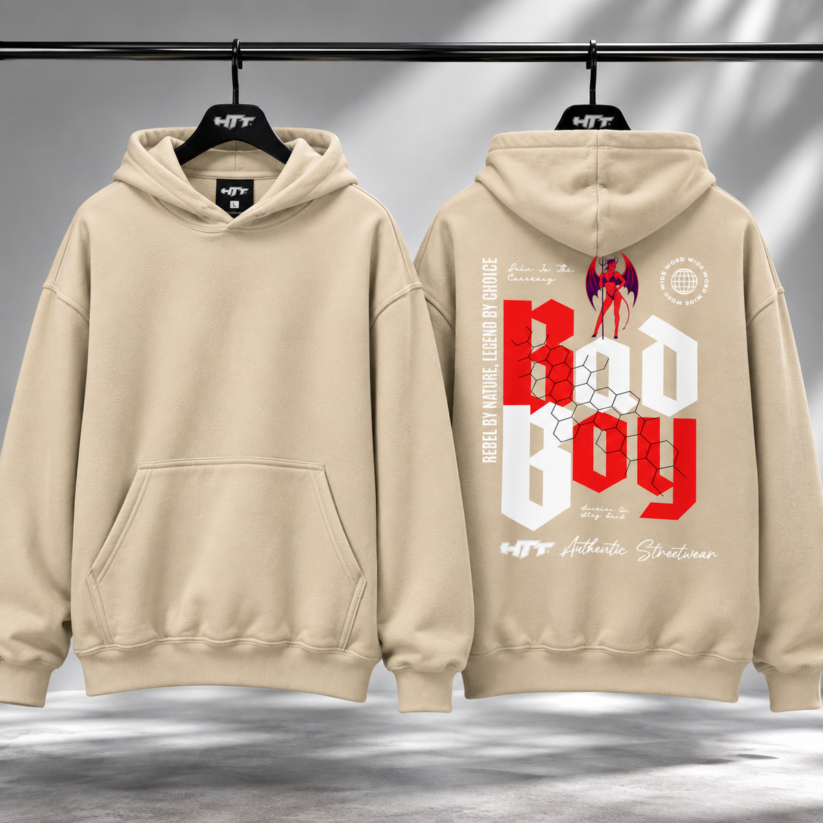 HTT BadBoy Heavy Hoodie Sand – clean voorkant en graphic achterkant op hanger