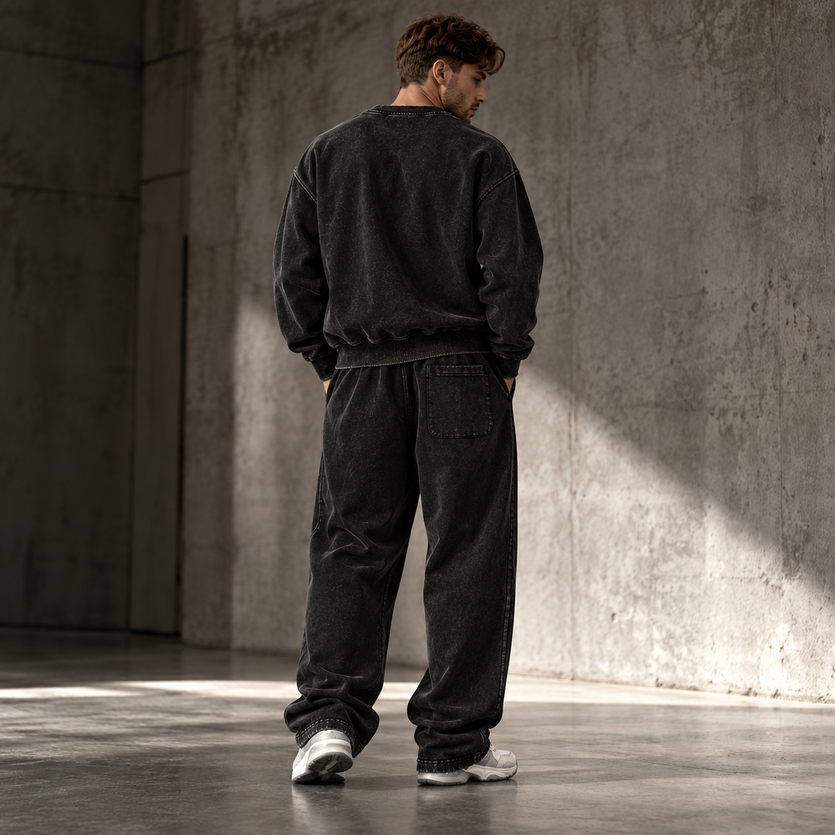 HTT Streetwear Faded Black heavyweight set on male model back view – oversized sweater and relaxed sweatpants