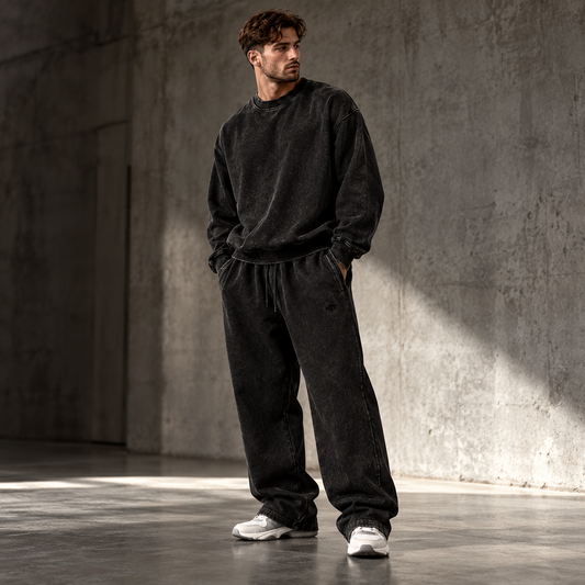 HTT Streetwear Faded Black heavyweight set on male model front view – oversized sweater and relaxed sweatpants