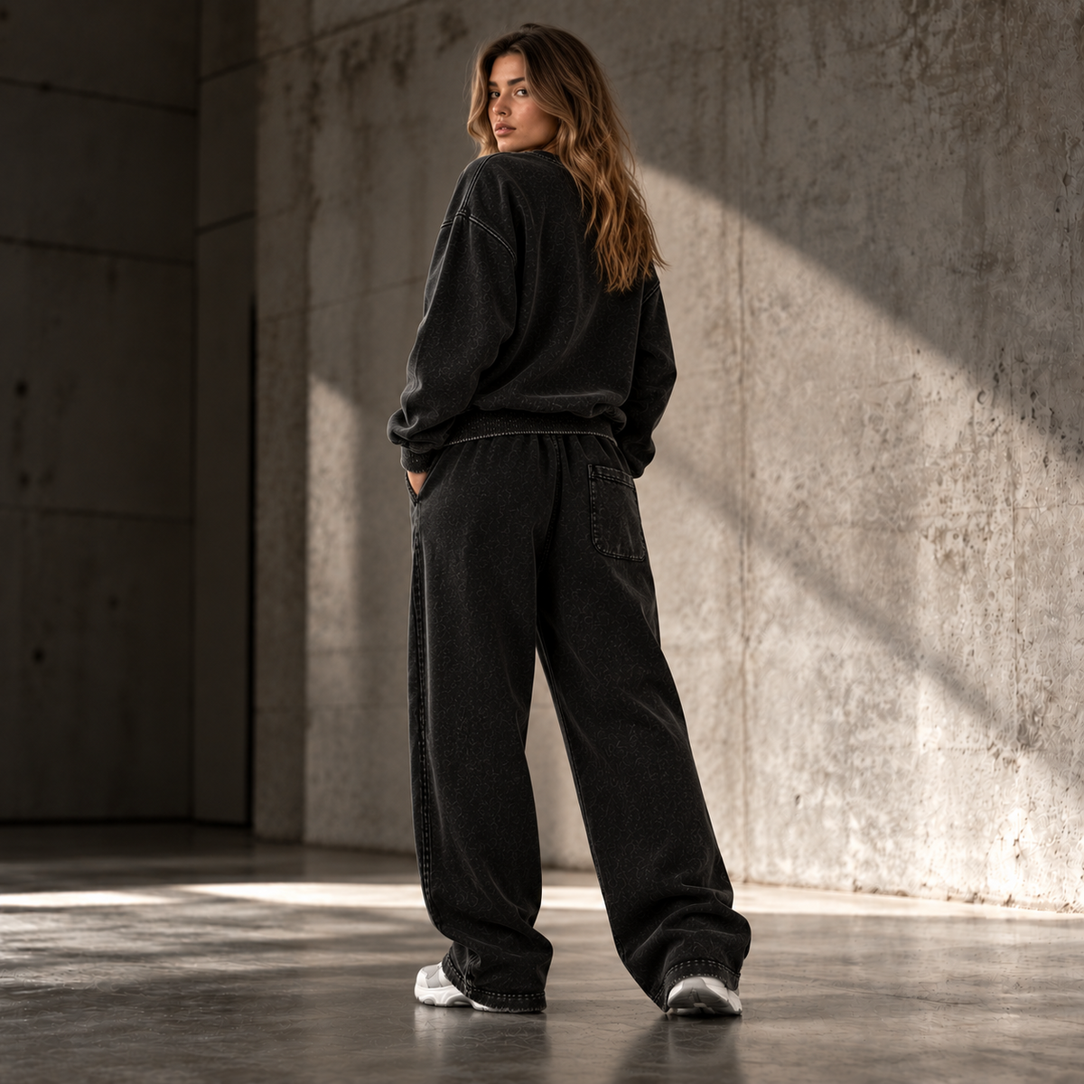 HTT Streetwear Faded Black heavyweight set on female model back view – oversized sweater and relaxed sweatpants