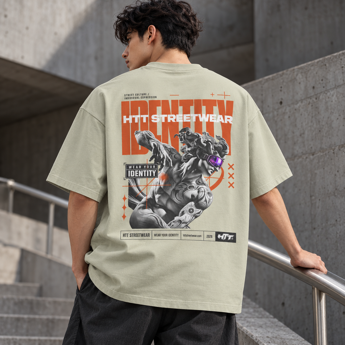 HTT Identity Sculpt oversized T-shirt in Pastel Gray, back graphic shown on a digital male model in a concrete setting.
