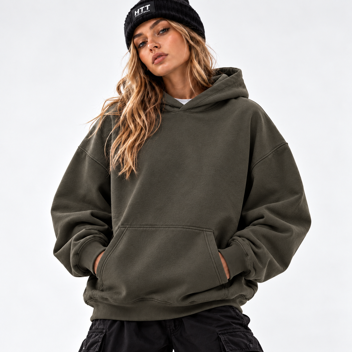 HTT Mountain Peak oversized hoodie Charcoal Grey olive tone, front view on female model